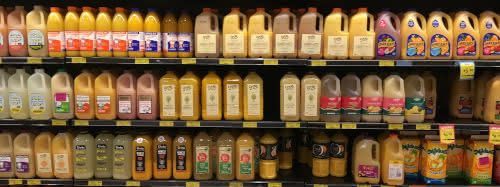 photo of a shelf full of fruit juices