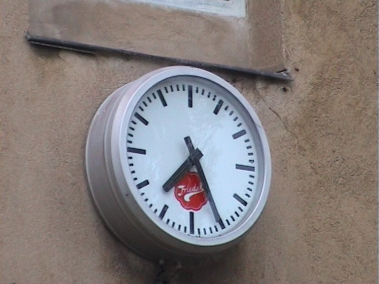 picture of a clock on a run-down building